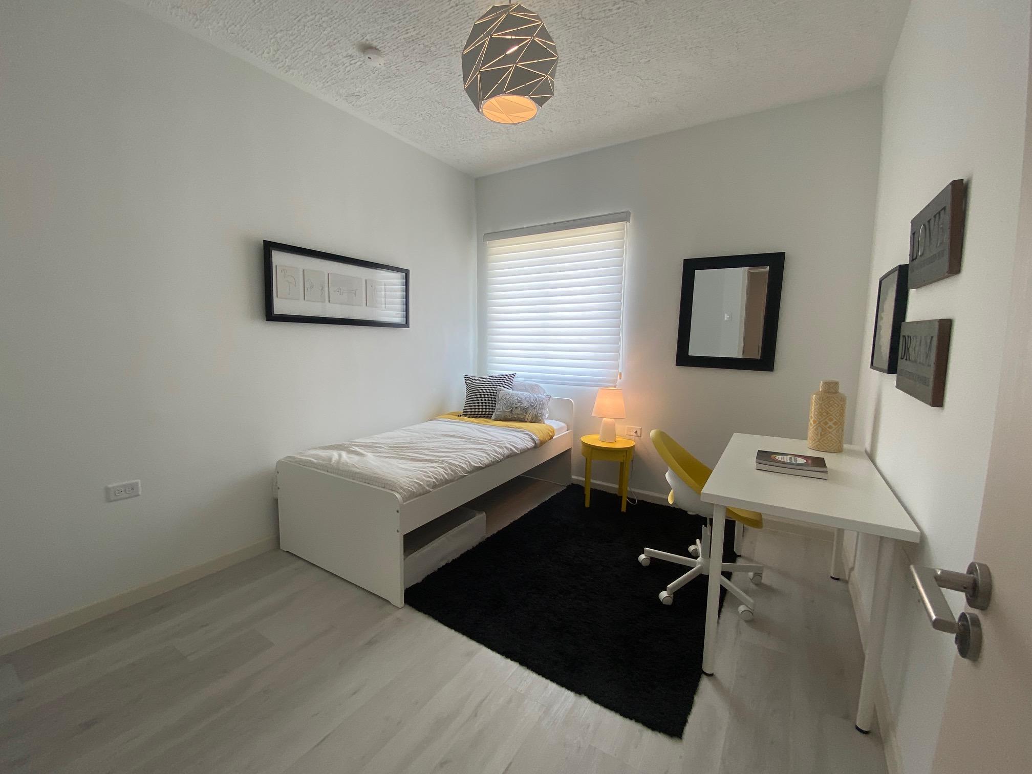 City Heights San Fernando apartment building Trinidad — modern high-rise with parking and scenic views